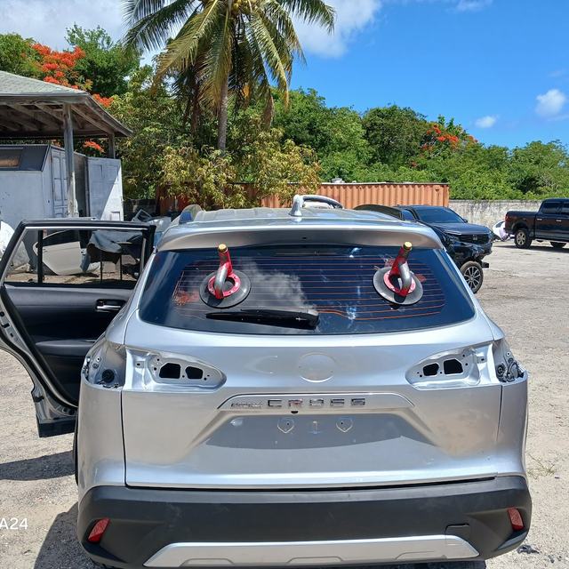 SUV with rear glass being fitted